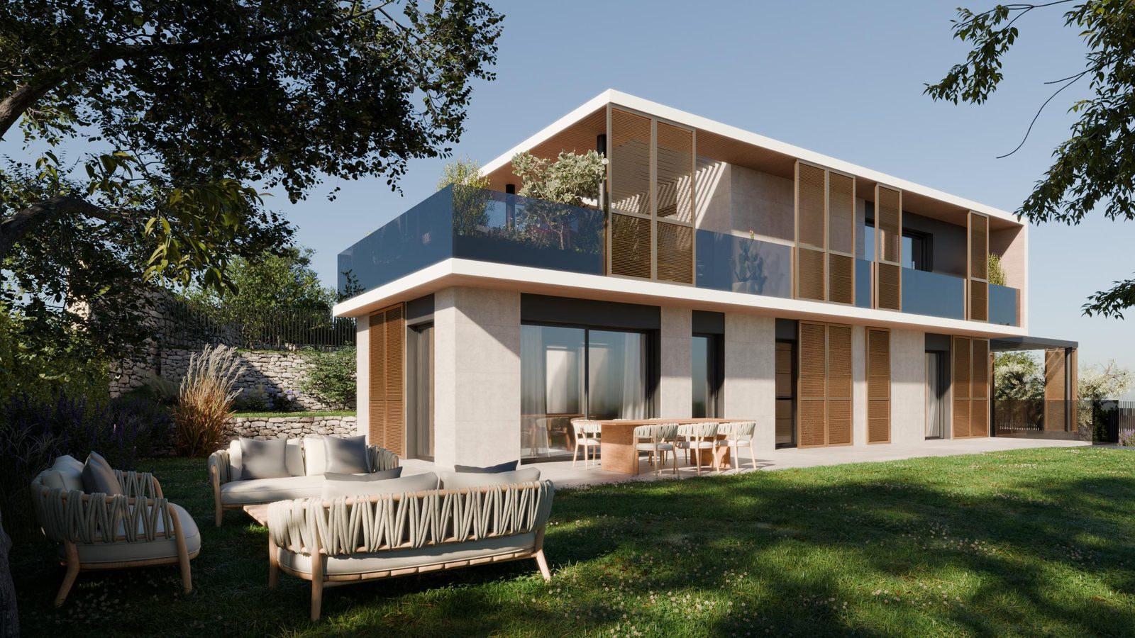 Der Privatgarten mit Outdoor-Lounge vor den Fensterfronten